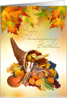 Birthday on Thanksgiving day card with Cornucopia and leaves. card